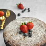 Torta Caprese - flourless Chocolate Cake, with golden fork