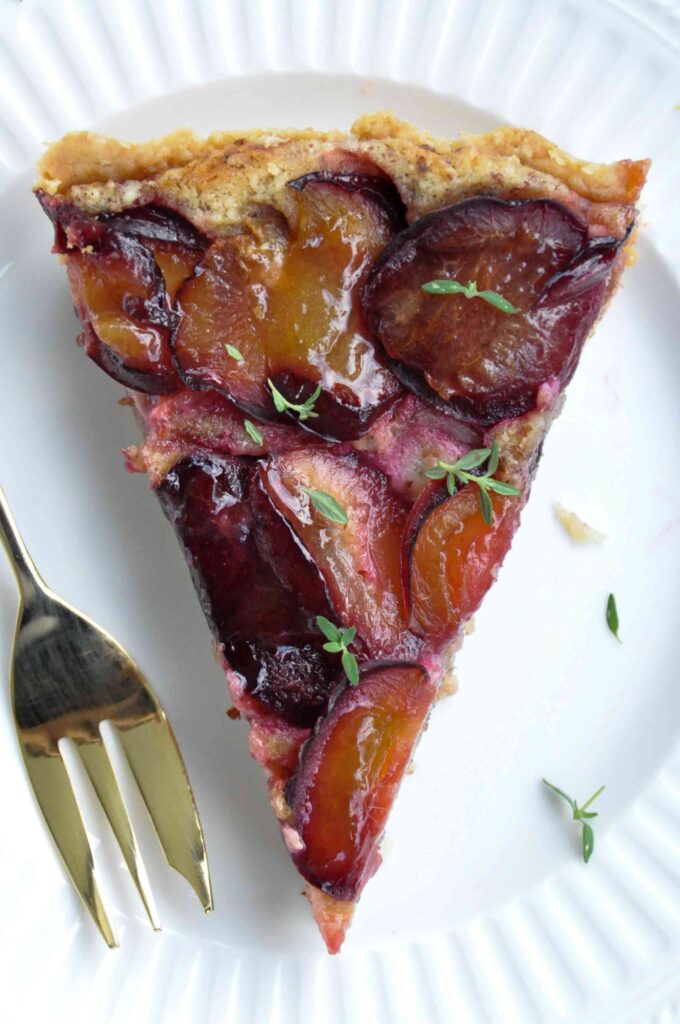 Plum Hazelnut Frangipane Tart, one slice, fork