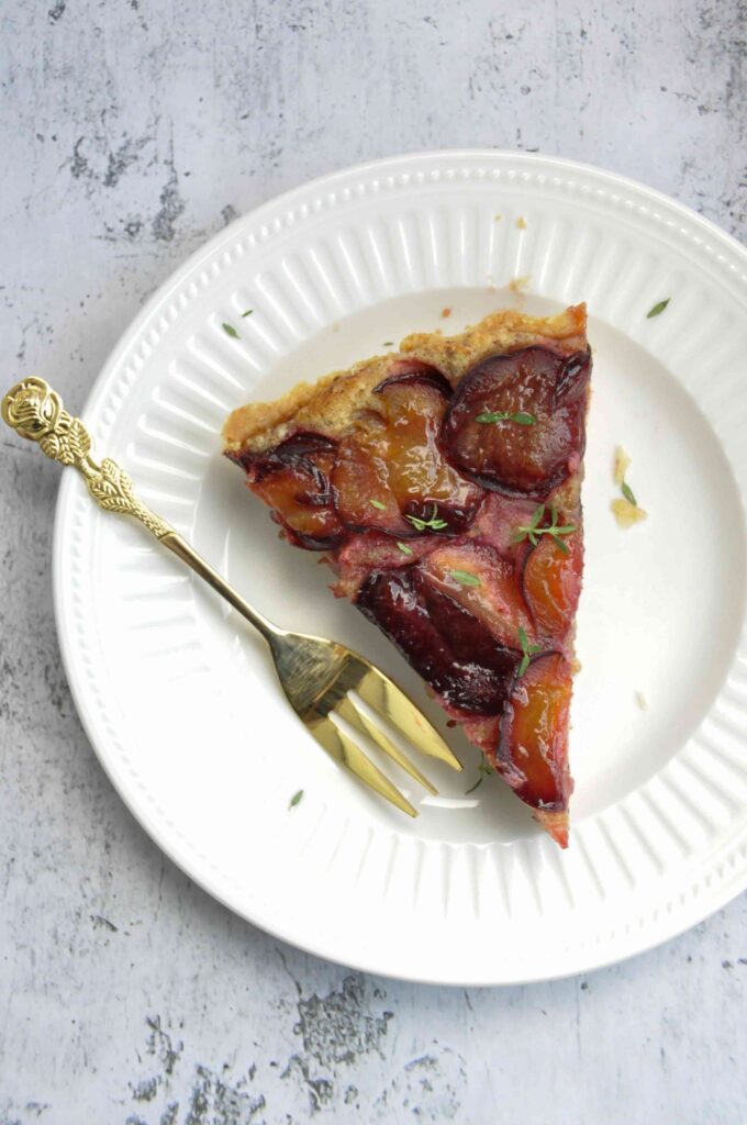 Plum Hazelnut Frangipane Tart single on a plate