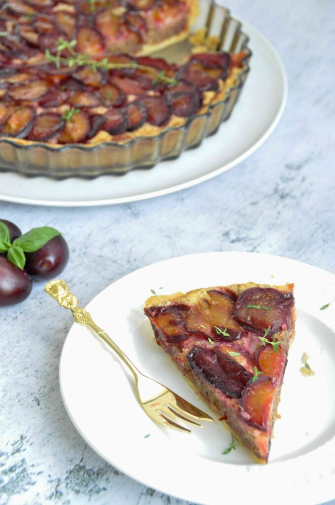 Plum Hazelnut Frangipane Tart white background