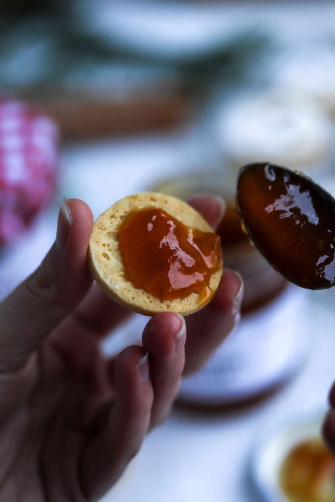 Linzer Cookies smearing jam in