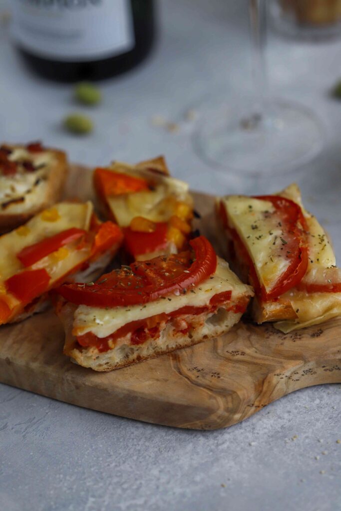 Different Appetizer Baguettes on a wooden board