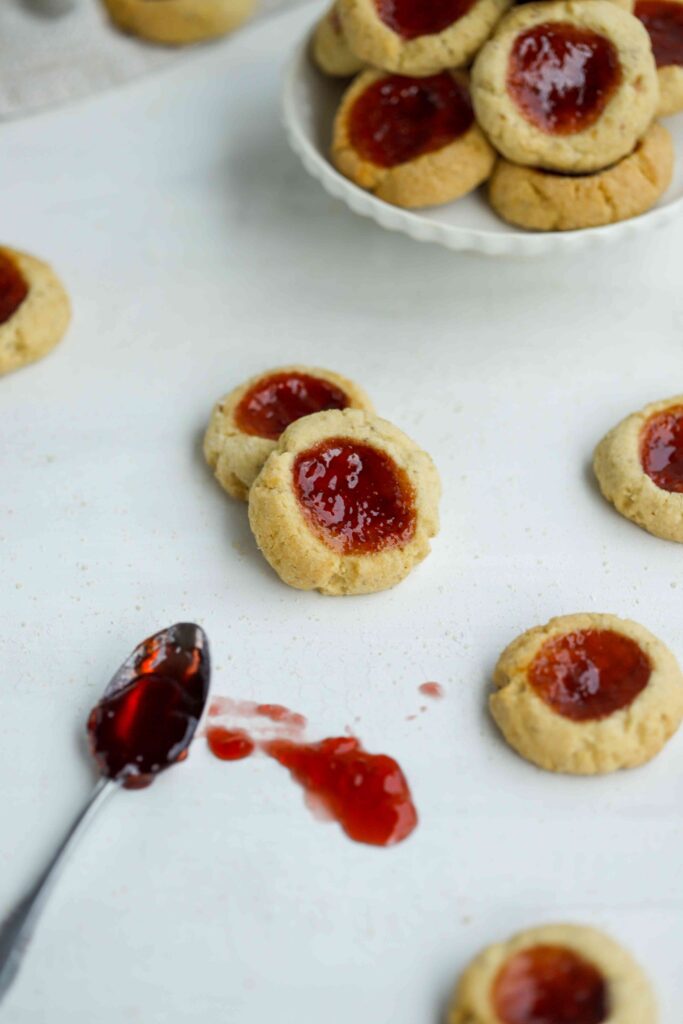 Almond Thumbprint Cookies with spoon of jam