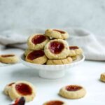 Almond Thumbprint Cookies on a cake stand