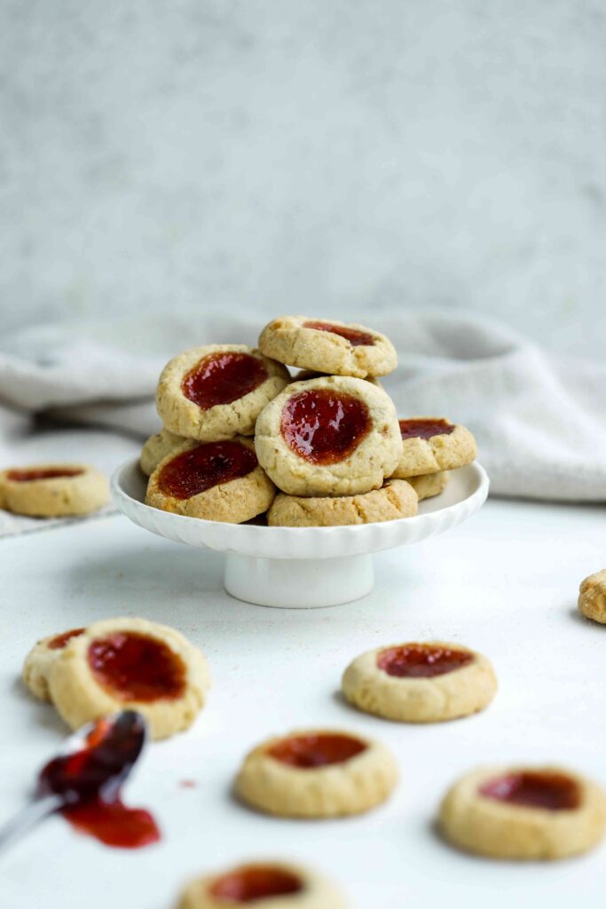 Almond Thumbprint Cookies on a cake stand