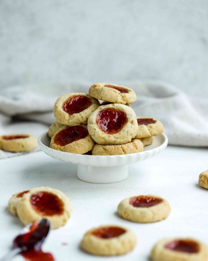Almond Thumbprint Cookies on a cake stand