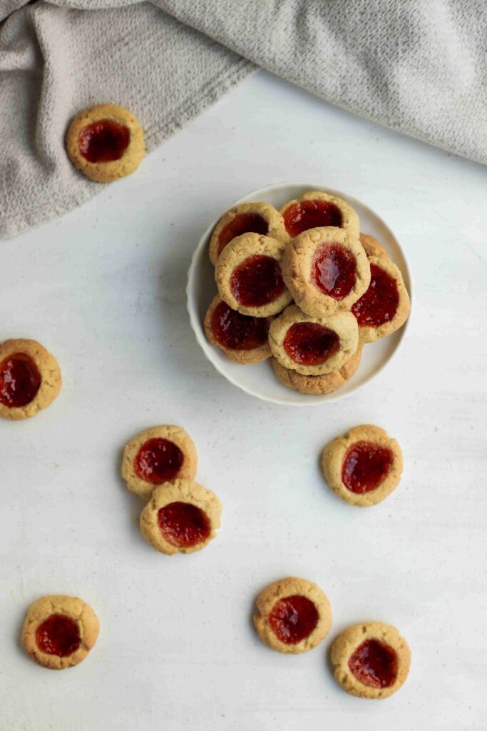 Top view Almond Thumbprint Cookies with linen
