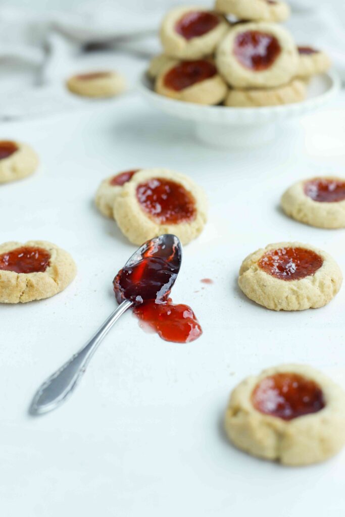 Almond Thumbprint Cookies spoon of jam