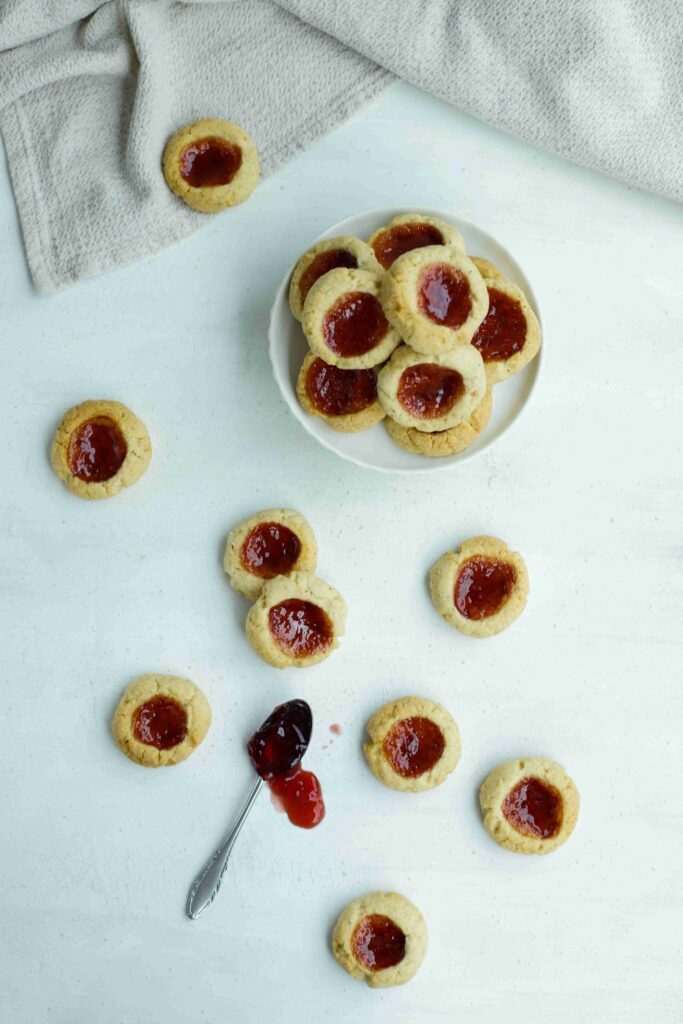 Top view Almond Thumbprint Cookies with jam
