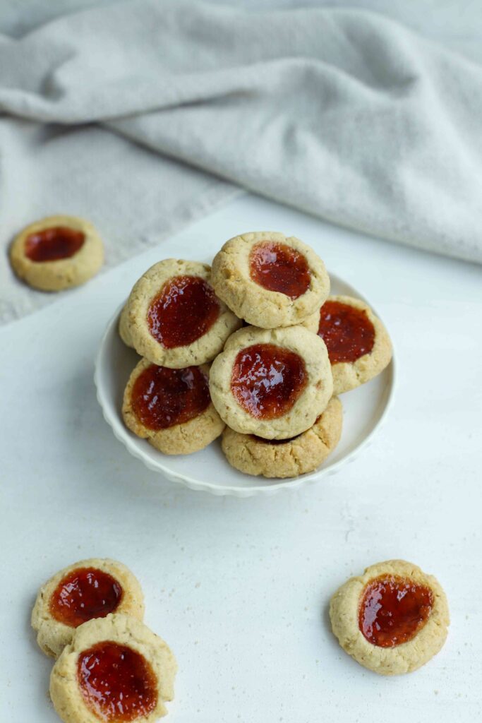 Almond Thumbprint Cookies on a pile