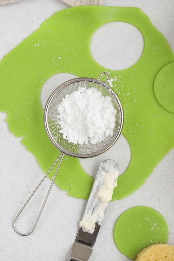 Powdered sugar on green marzipan