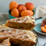 Apricot Frangipane Tart Slice in hand